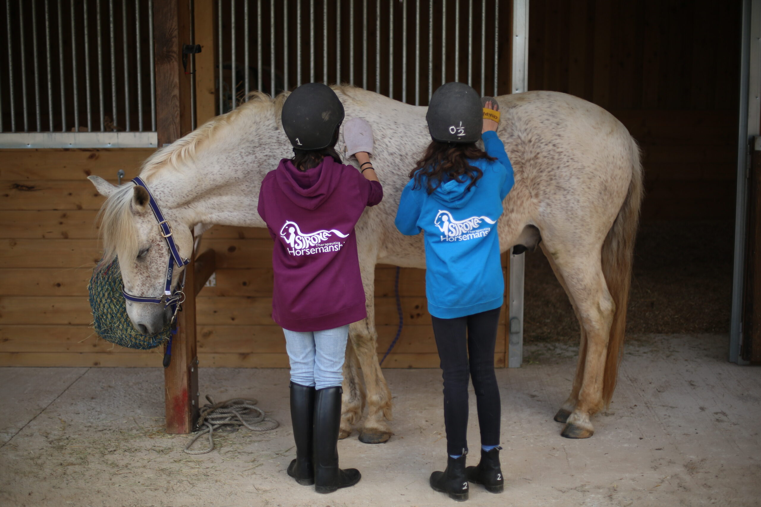 2 girls groom chaps back